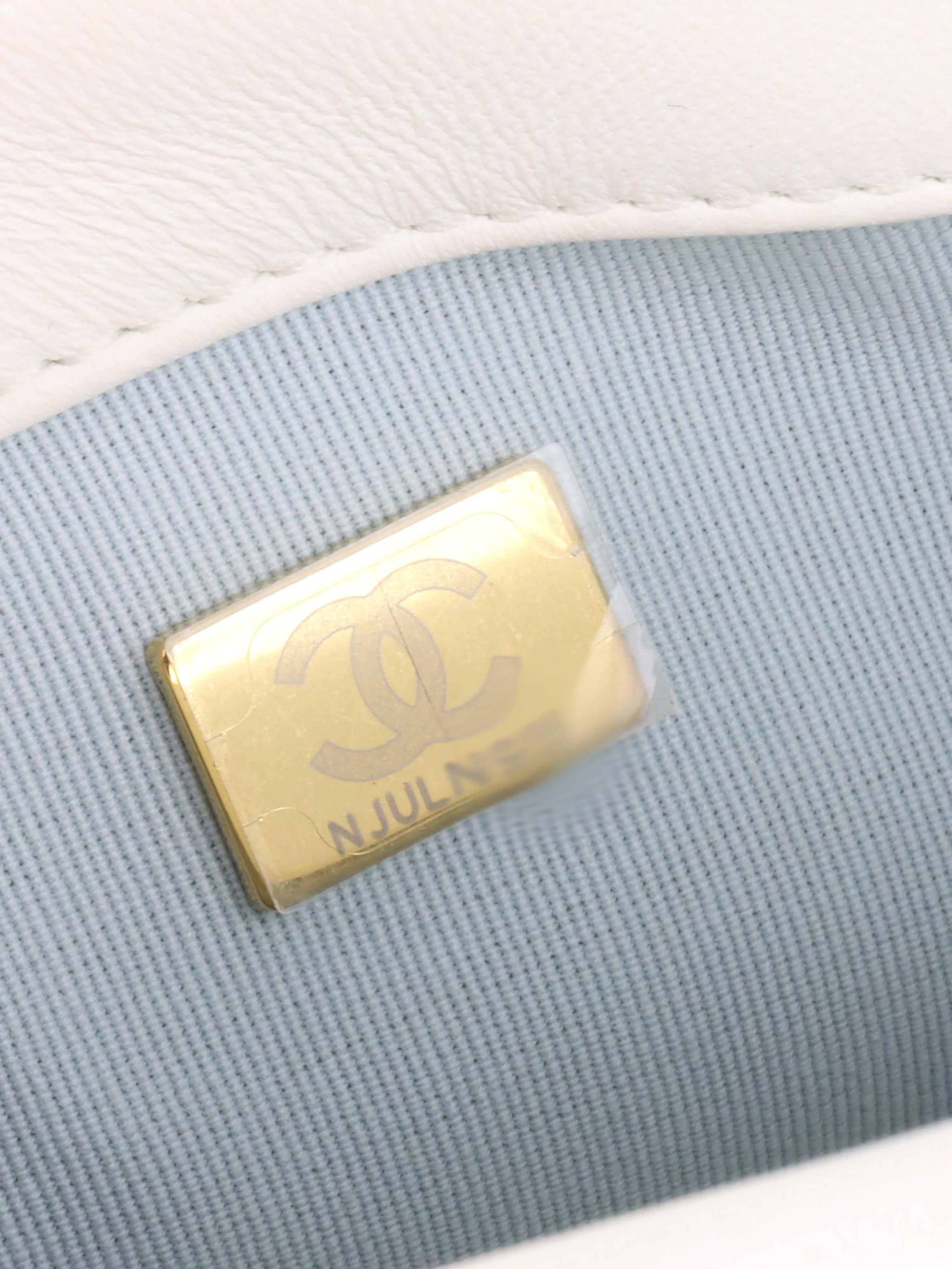 Chanel White and Pearl Chain Flap Bag.