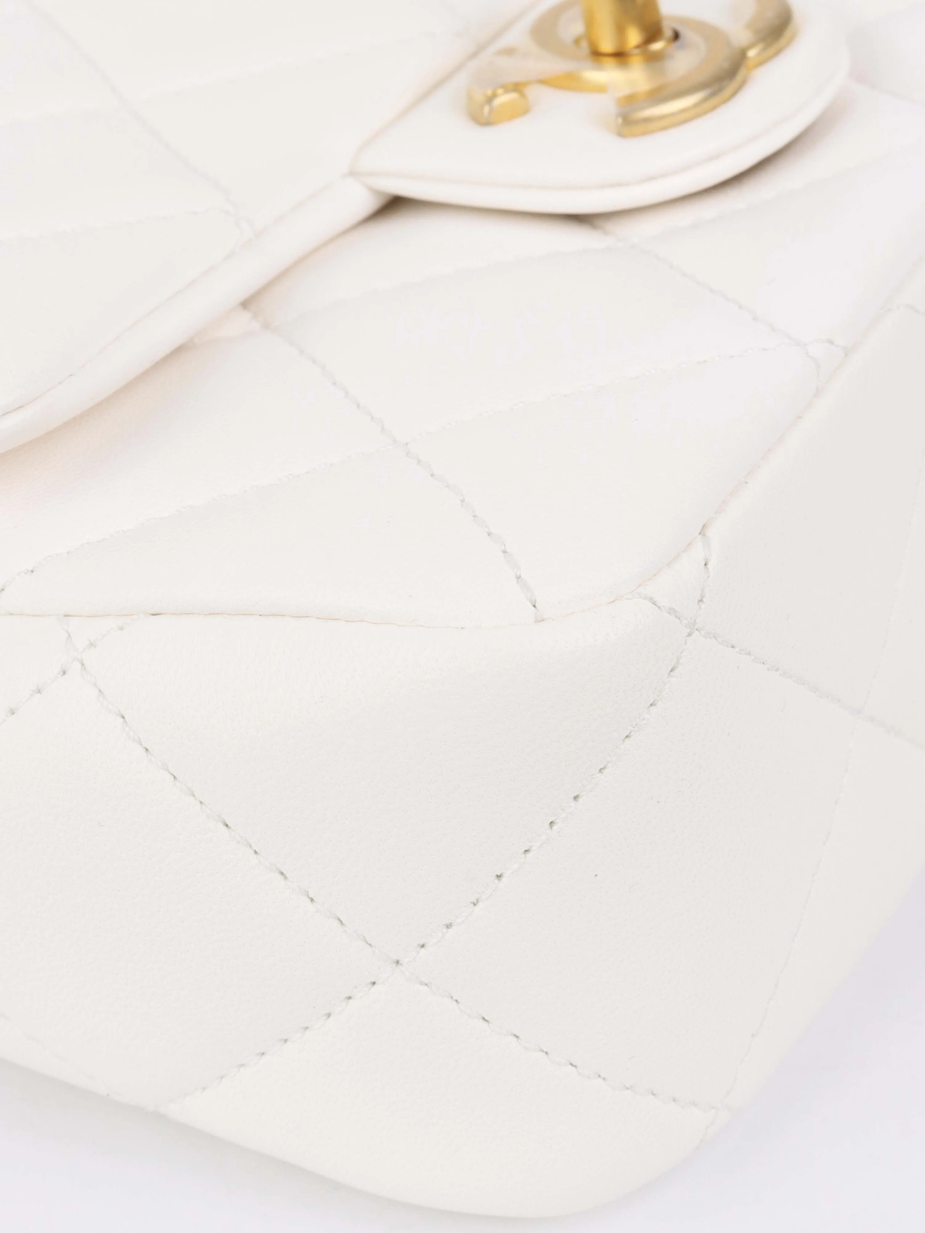 Chanel White and Pearl Chain Flap Bag.